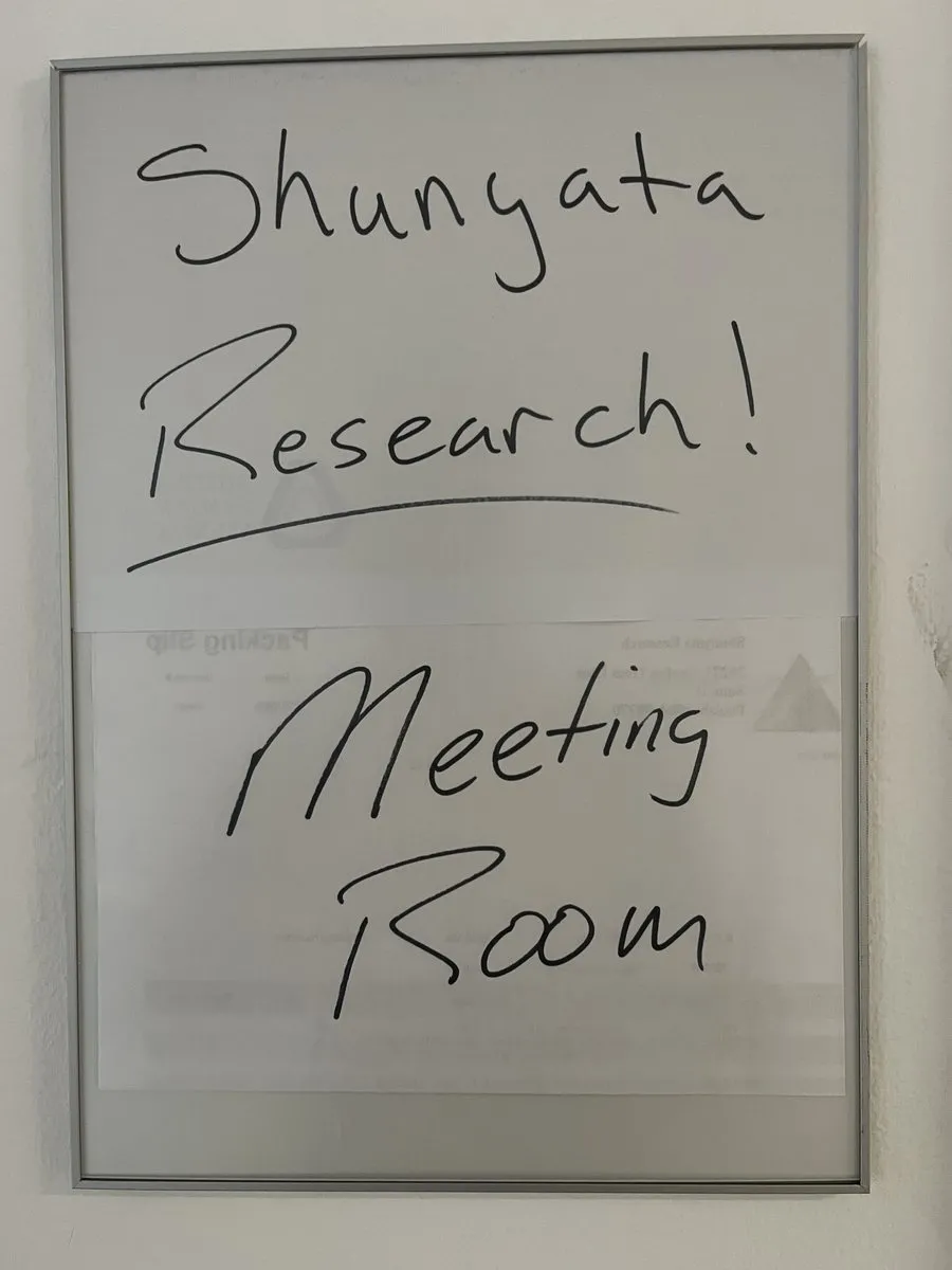 A whiteboard with the words 'Shunyata Research Meeting Room' written on it.